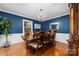 Elegant dining room with hardwood floors, a chandelier, and dark wood furniture at 3029 River Rd, Shelby, NC 28152