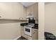 Retro kitchen with white appliances and dark countertops at 3029 River Rd, Shelby, NC 28152