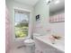 Clean bathroom featuring a pink-tiled shower and a large window at 3029 River Rd, Shelby, NC 28152