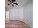 Spacious bedroom with ceiling fan and hardwood floors at 450 Cherry St, Wadesboro, NC 28170