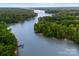 Stunning aerial view of a serene lake with lush greenery and waterfront properties at 6034 Jepson Ct, Charlotte, NC 28214