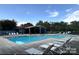 Community pool with lounge chairs and covered area at 7201 Winery Ln, Charlotte, NC 28227