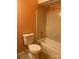 Bathroom with peach walls and a toilet, shower/tub combo at 7201 Winery Ln, Charlotte, NC 28227