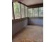 Empty screened porch with view of backyard at 7201 Winery Ln, Charlotte, NC 28227