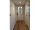Light and bright entryway with hardwood floors and white walls at 7201 Winery Ln, Charlotte, NC 28227