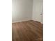 Bright bedroom showcasing hardwood floors and a closet at 7201 Winery Ln, Charlotte, NC 28227