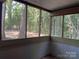 Screened porch overlooking a backyard with bamboo at 7201 Winery Ln, Charlotte, NC 28227