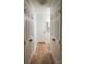 Bright hallway with light walls and wood-look floors at 7201 Winery Ln, Charlotte, NC 28227