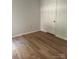 Spacious bedroom with hardwood floors and an adjacent closet at 7201 Winery Ln, Charlotte, NC 28227