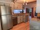 Updated kitchen with stainless steel appliances and light teal cabinets at 7201 Winery Ln, Charlotte, NC 28227