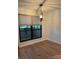 Dining area with hardwood floors and modern light fixture at 7201 Winery Ln, Charlotte, NC 28227