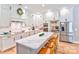 Modern kitchen featuring white cabinets, a large island, and stainless steel appliances at 14941 Deer Hollow Dr, Gold Hill, NC 28071