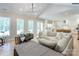 Open living space with a large sectional sofa and a view into the kitchen at 14941 Deer Hollow Dr, Gold Hill, NC 28071