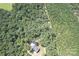 House nestled in a wooded area with a paved driveway at 14941 Deer Hollow Dr, Gold Hill, NC 28071