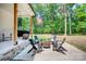 Relaxing patio area with fire pit and seating, nestled in a wooded setting at 14941 Deer Hollow Dr, Gold Hill, NC 28071