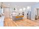 Spacious kitchen with white cabinets, center island and stainless steel appliances at 14941 Deer Hollow Dr, Gold Hill, NC 28071