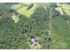 Property with a house surrounded by dense forest and farmland at 14941 Deer Hollow Dr, Gold Hill, NC 28071