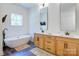Elegant bathroom with double vanity, soaking tub, and walk-in shower at 14941 Deer Hollow Dr, Gold Hill, NC 28071