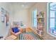 Bright home office with built-in shelving and large windows at 14941 Deer Hollow Dr, Gold Hill, NC 28071