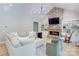 Spacious living area with a cozy stone fireplace and built-in shelving at 14941 Deer Hollow Dr, Gold Hill, NC 28071