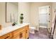 Modern bathroom with a light wood vanity and a walk-in shower at 14941 Deer Hollow Dr, Gold Hill, NC 28071