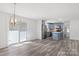 Dining area with hardwood floors and view into the kitchen at 2009 Echo Ln, Gastonia, NC 28052