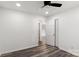 Simple bedroom with ceiling fan, wood-look floors, and access to hallway at 2009 Echo Ln, Gastonia, NC 28052