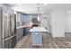 Modern kitchen with blue cabinets, quartz countertops and island at 2009 Echo Ln, Gastonia, NC 28052