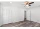 Bedroom with wood-look flooring, ceiling fan, and a closet at 2009 Echo Ln, Gastonia, NC 28052