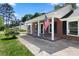 Charming covered porch with brick columns and an American flag at 2009 Echo Ln, Gastonia, NC 28052