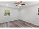 Bright bedroom with wood-look flooring and a ceiling fan at 2009 Echo Ln, Gastonia, NC 28052
