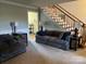 Spacious living room with stairs and a view into another room at 331 Polk Ford Rd, Stanfield, NC 28163