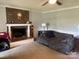 Cozy living room featuring a brick fireplace and comfortable couch at 331 Polk Ford Rd, Stanfield, NC 28163
