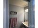 Small bathroom with pink towel and wood floor at 331 Polk Ford Rd, Stanfield, NC 28163