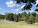 Landscaped yard with trees and road access at 331 Polk Ford Rd, Stanfield, NC 28163