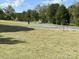 Landscaped yard with trees and road access at 331 Polk Ford Rd, Stanfield, NC 28163