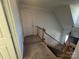 Upstairs hallway with carpeted floors and a door at 331 Polk Ford Rd, Stanfield, NC 28163