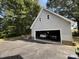 Double-car garage with two vehicles parked inside at 331 Polk Ford Rd, Stanfield, NC 28163