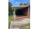 Covered patio with brick flooring, providing shade and outdoor seating at 500 W 22Nd St, Kannapolis, NC 28081