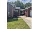 Brick home showcasing a side entrance and partial view of the backyard at 500 W 22Nd St, Kannapolis, NC 28081