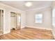 Spacious bedroom with hardwood floors and mirrored closet doors at 6800 Terry Ln, Charlotte, NC 28215