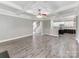 Open living room with hardwood floors and coffered ceiling at 4206 Oldstone Forest Dr, Waxhaw, NC 28173