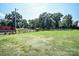 Fenced pasture area with a wooden shelter and green grass at 7514 Secrest Shortcut Rd, Indian Trail, NC 28079