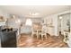 Cozy kitchen with light gray cabinets and a round dining table at 7514 Secrest Shortcut Rd, Indian Trail, NC 28079