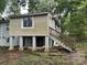 Rear view of a house with a wooden deck and stairs at 2102 Twin Ave, Gastonia, NC 28052