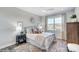 Cozy bedroom with a striped comforter and large window at 3245 Mcharney Dr # 28, Harrisburg, NC 28075