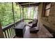 Relaxing screened porch with seating and fire pit at 506 Island Ford Rd, Statesville, NC 28625