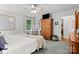 Spacious bedroom with a king-size bed, large closet, and wood armoire at 355 Davies Cir, Cleveland, NC 27013