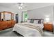 King-size bed, dresser, and plenty of natural light in this bedroom at 355 Davies Cir, Cleveland, NC 27013