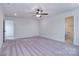 Spacious bedroom with carpet and access to bathroom at 144 Fleming Dr, Statesville, NC 28677